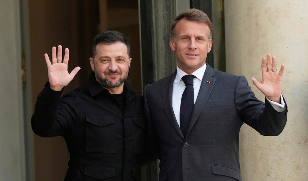 French President Emmanuel Macron, right, and Ukraine's President Volodymyr Zelensky wave to journalists prior to a meeting, at the Elysee Palace, in Paris, France, Wednesday, Sept. 3, 2025. (AP)