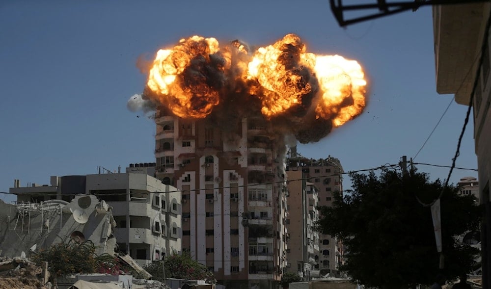 Flames erupt from a building following an Israeli strike in Gaza City, Sunday, Sept. 14, 2025. (AP)