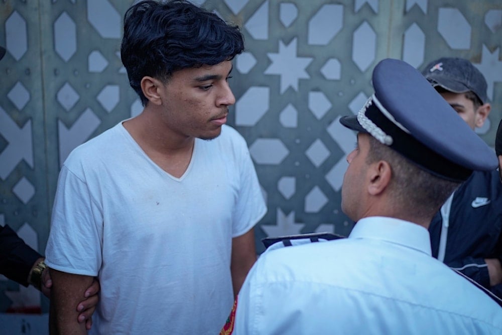 A boy is detained while taking part in a youth-led protest calling for education and health reforms, in Casablanca, Morocco, Monday, September 29, 2025 (AP)