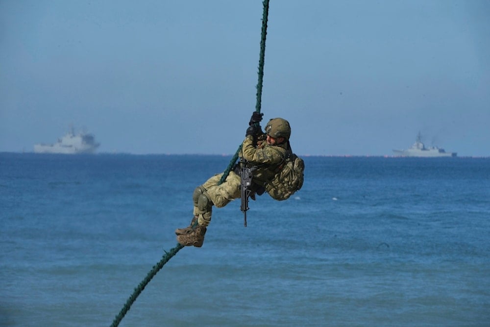 A Turkish Navy soldier participates during the NATO Dynamic Mariner/Flotex-25 naval exercise in Barbate, southern Spain, Friday, March 28, 2025 (AP)