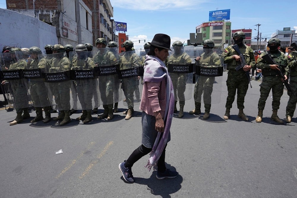 Soldiers stand guard during an Indigenous anti-government protest in Latacunga, Ecuador, Monday, Sept. 22, 2025. (AP Photo/Dolores Ochoa)