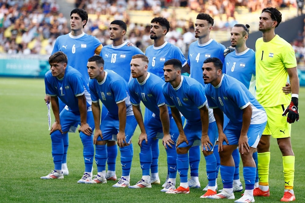 The Israeli team poses prior to the Group D soccer match between the Israeli occupation and Japan, at the La Beaujoire stadium, at the 2024 Summer Olympics, July 30, 2024, in Nantes, France (AP)