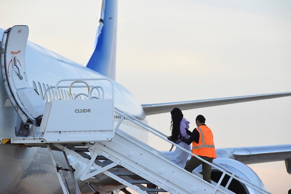 FILE - Venezuelan migrants board a plane heading back to their home country from Harlingen, Texas, on Wednesday, Oct. 18, 2023. (AP Photo/Valerie Gonzalez, File)