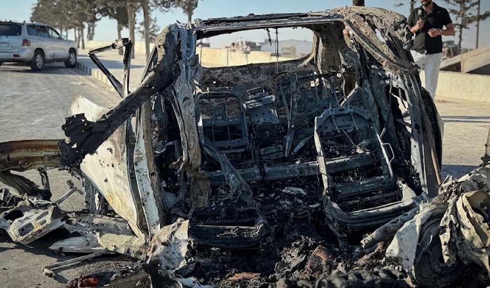 The wreck of a car that was airstruck by International Coalition forces on the Aleppo Airport Road, Syria, September 4, 2025 (X/ @Sana_gov)