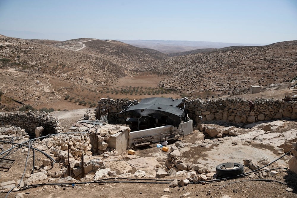 A stockyard that suffered damage following a settlers' attack from nearby settlement outposts on the Bedouin community, in the West Bank village of al-Mufagara, near al-Khalil, Thursday, Sept. 30, 2021 (AP)