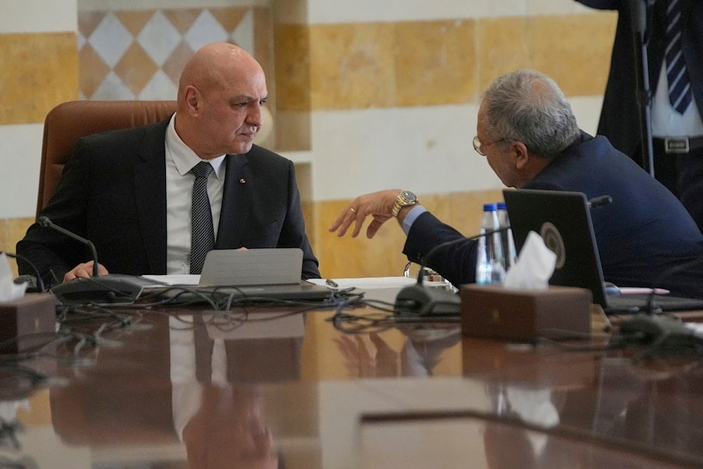 Lebanese President Joseph Aoun, left, speaks with Tarek Mitri, the deputy prime minister, during a cabinet meeting to discuss the army plan for disarming Hezbollah, at the Presidential palace in Baabda, east of Beirut, Friday, Sept. 5, 2025 (AP)