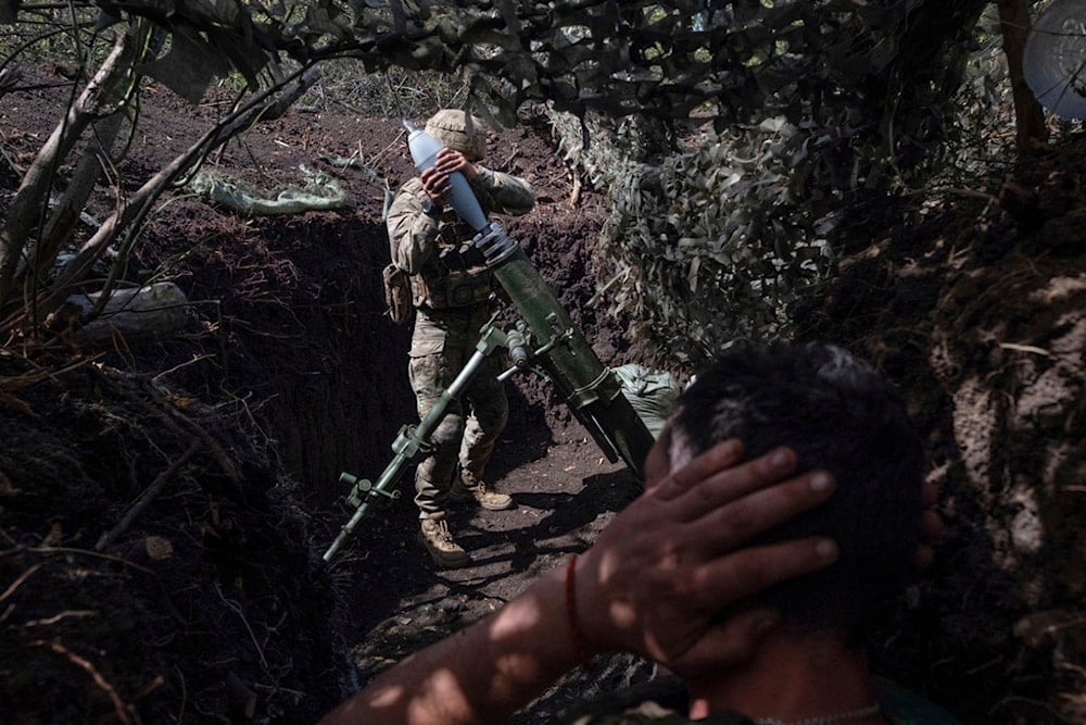 Ukrainian soldiers fire a mortar towards positions of Russian troops near Kostyantynivka in Donetsk region, Ukraine, Tuesday, Aug. 26, 2025. (Iryna Rybakova/Ukraine's 93rd Mechanized Brigade via AP)
