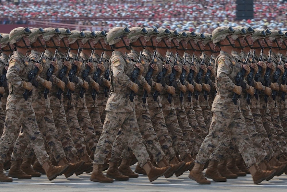 Military personnel march past Tiananmen Gate as they take part in a military parade to commemorate the 80th anniversary of Japan's World War II surrender, in Beijing, Wednesday, Sept. 3, 2025. (AP Photo/Andy Wong)