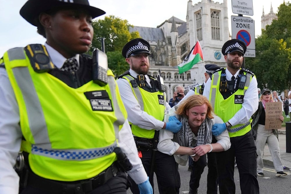 Police officers carry a protester during a protest to support Palestine Action in London, Saturday, September 6, 2025 (AP)