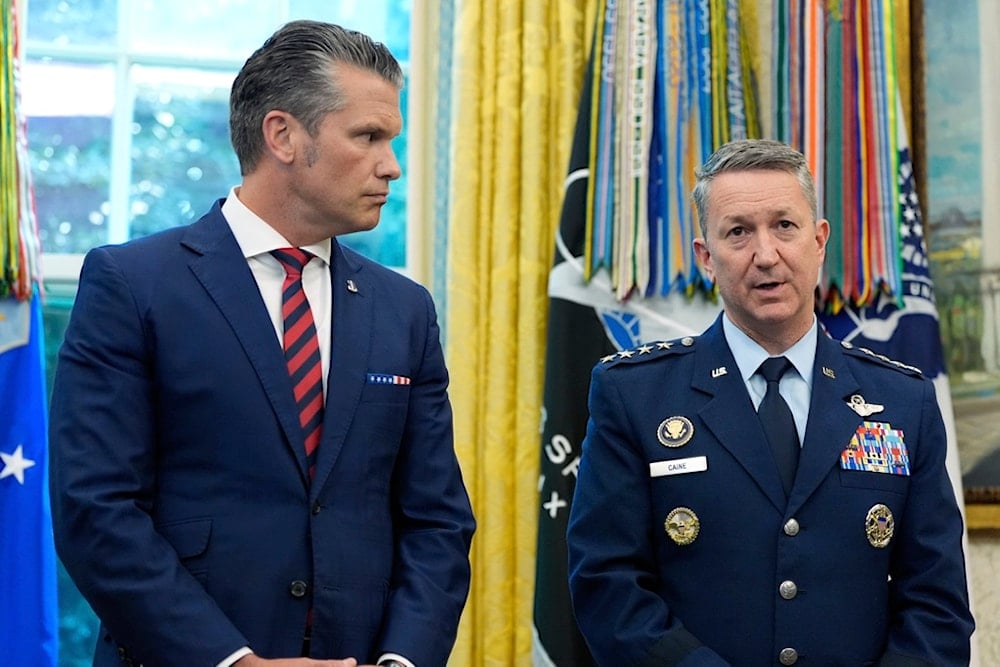 War Secretary Pete Hegseth listens as Chairman of the Joint Chiefs of Staff Gen. Dan Caine speaks during an event with President Donald Trump in the Oval Office of the White House, Friday, September 5, 2025, in Washington (AP)