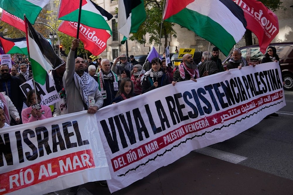 People march during a pro-Palestinian rally, in Madrid, Spain, Saturday, December 2, 2023 (AP)