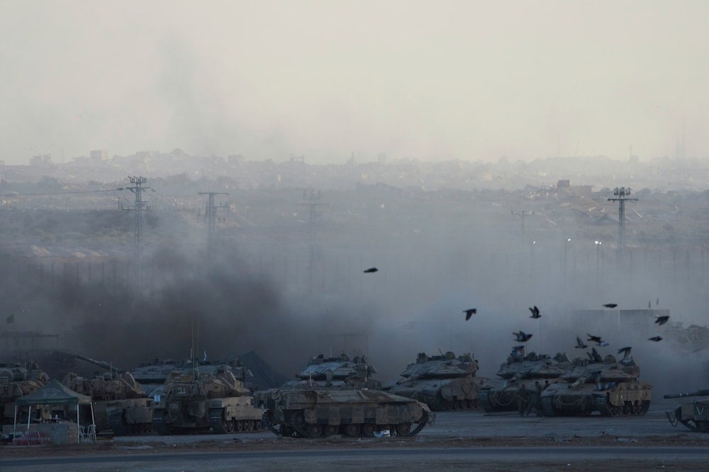 Israeli soldiers work on a tank in a gathering area on the border with the Gaza Strip in southern Israel , Wednesday, Sept. 3, 2025 (AP)