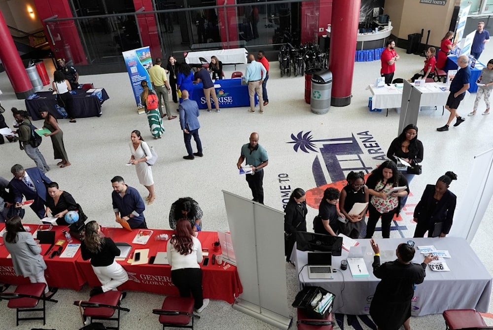 Job seekers attend a job fair, Thursday, Aug. 28, 2025, in Sunrise, Fla. (AP Photo/Marta Lavandier)
