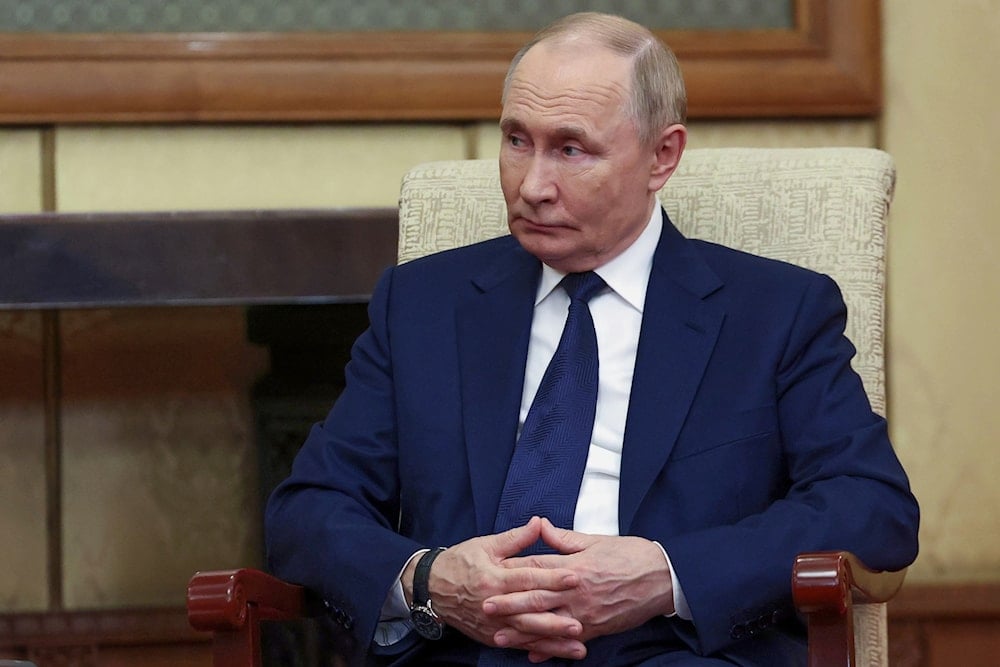 Russian President Vladimir Putin listens to Serbian President Aleksandar Vucic during their meeting at Diaoyutai State Guesthouse in Beijing, China, Tuesday, Sept. 2, 2025 (AP)